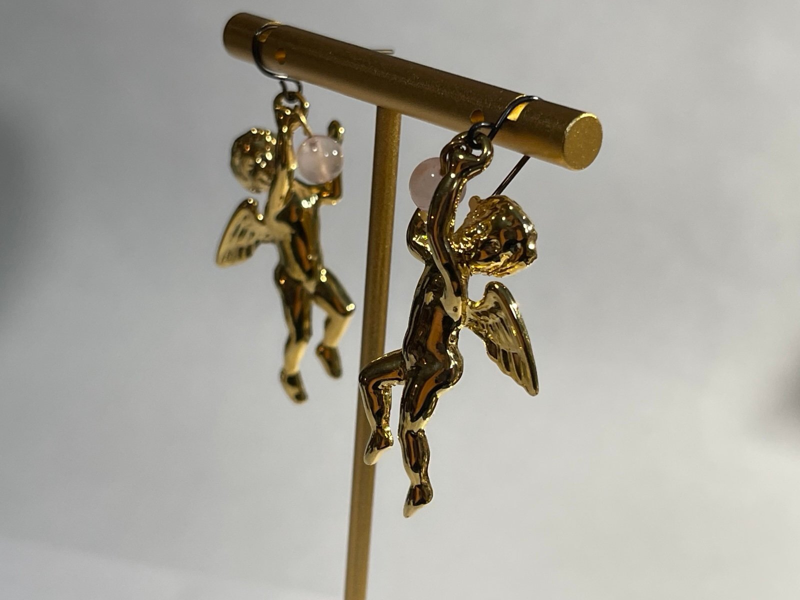 Lee Sands Goldtone Cherub Dangle Earrings with Rose Quartz Orb