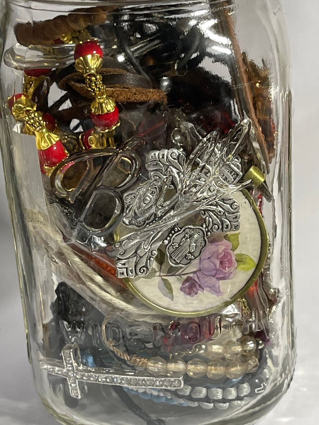 Jar of Religious Bracelets Necklaces Pendants Keychains