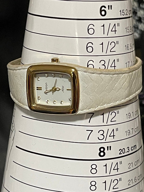 Armitron Now Ladies Goldtone Bezel Rhinestone Accent Dial White Leather Band